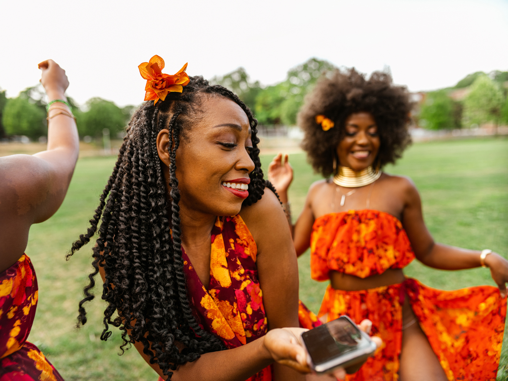Young black women dancing in the field